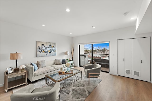 321 S Oxford Ave Unit 603, Los Angeles, CA 90020 - living area featuring light wood finished floors and recessed lighting