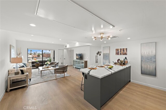321 S Oxford Ave Unit 603, Los Angeles, CA 90020 - kitchen featuring light wood-style flooring, modern cabinets, open floor plan, recessed lighting, and a peninsula
