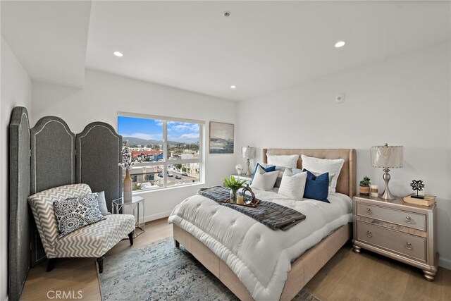 321 S Oxford Ave Unit 603, Los Angeles, CA 90020 - bedroom with wood finished floors, recessed lighting, and baseboards