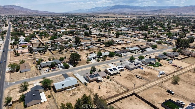 aerial view of property's location featuring a mountainous background
