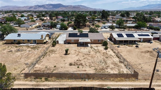 aerial perspective of suburban area with a mountainous background