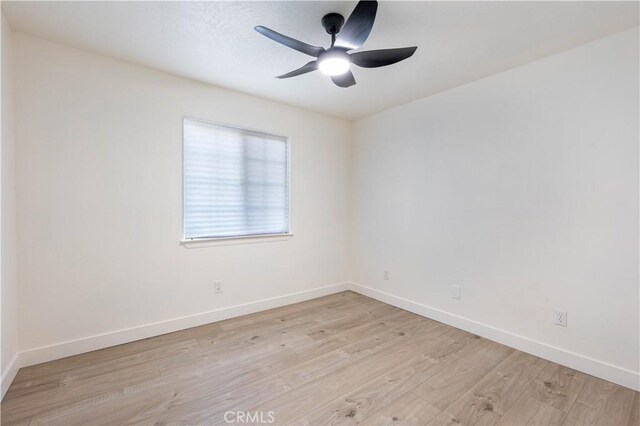 12830 Lakota Rd, Apple Valley, CA 92308 - empty room with light wood-style floors, baseboards, and ceiling fan