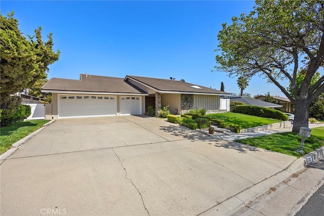 2132 Via Caliente, Fullerton, CA 92833 - single story home featuring a garage, driveway, and stone siding