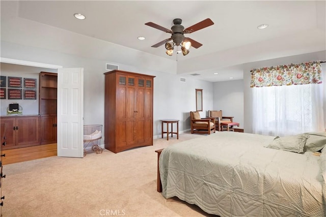 bedroom featuring light carpet, recessed lighting, and ceiling fan