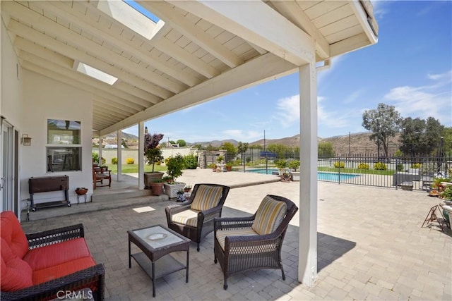 view of patio / terrace featuring fence