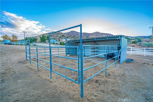 horse barn featuring a mountain view