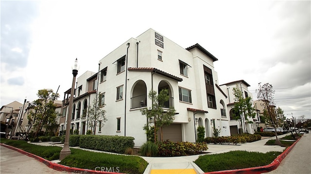 view of building exterior featuring a garage