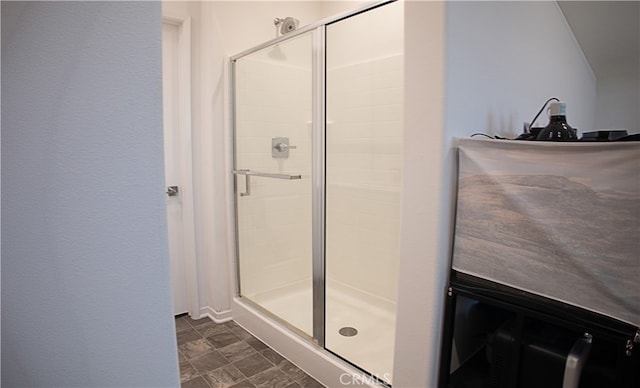 bathroom featuring a shower stall