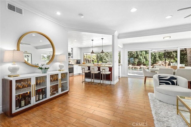 26351 Tarrasa Ln, Mission Viejo, CA 92691 - living room with ornamental molding, recessed lighting, and light wood-style floors