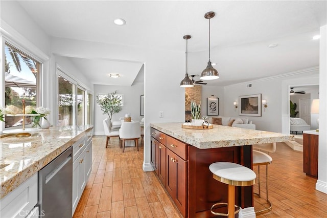 26351 Tarrasa Ln, Mission Viejo, CA 92691 - kitchen with a kitchen breakfast bar, dishwasher, light wood-style flooring, open floor plan, and light stone counters
