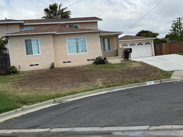 view of front of home with fence, driveway, stucco siding, a shingled roof, and crawl space