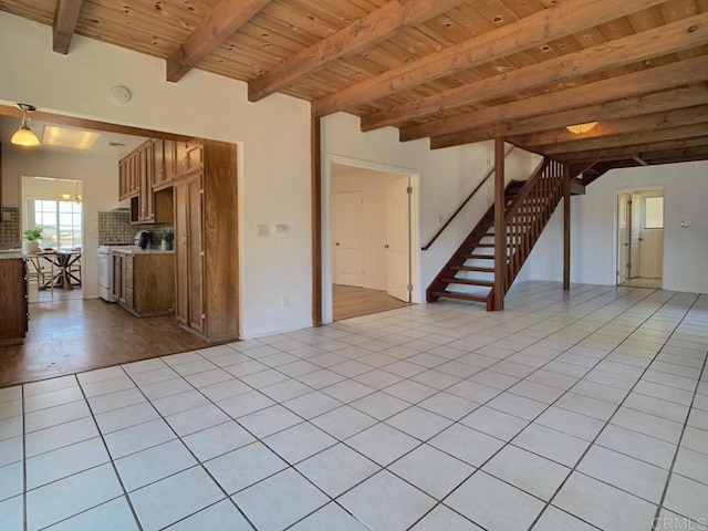 unfurnished living room with wood ceiling, stairway, beamed ceiling, and light tile patterned floors