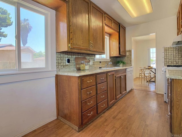 161 Twin Oaks Cir, Chula Vista, CA 91910 - kitchen with white appliances, light wood-type flooring, tasteful backsplash, and brown cabinetry