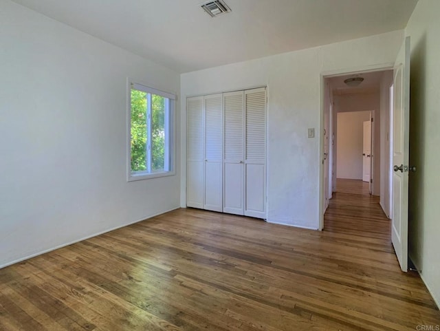 161 Twin Oaks Cir, Chula Vista, CA 91910 - unfurnished bedroom featuring wood-type flooring and a closet