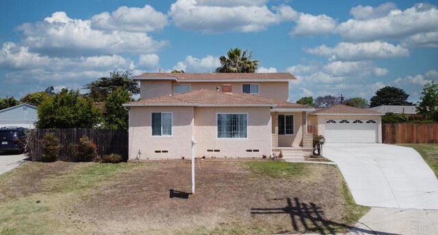 161 Twin Oaks Cir, Chula Vista, CA 91910 - traditional-style house featuring fence, concrete driveway, stucco siding, and a garage