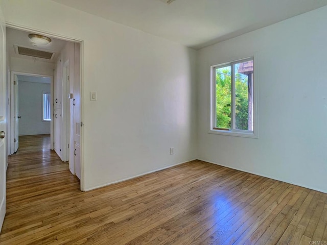 161 Twin Oaks Cir, Chula Vista, CA 91910 - spare room featuring light wood-style flooring and attic access