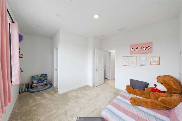 bedroom with carpet and baseboards