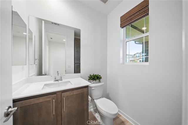 32182 Penstemon Way, Temecula, CA 92591 - half bath with toilet, vanity, baseboards, and wood finished floors