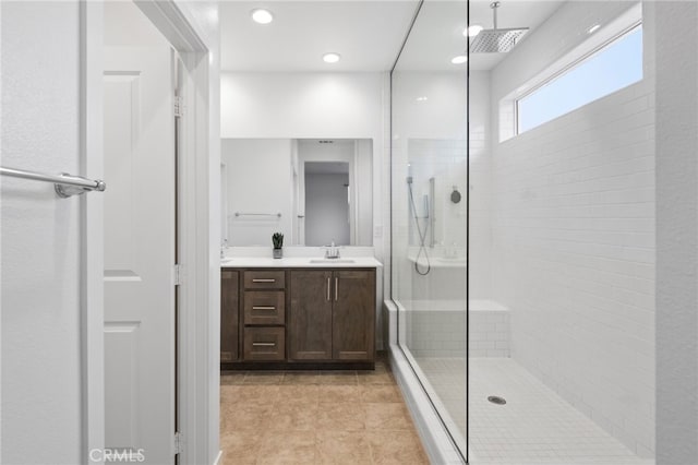 32182 Penstemon Way, Temecula, CA 92591 - bathroom featuring double vanity, walk in shower, tile patterned flooring, and recessed lighting
