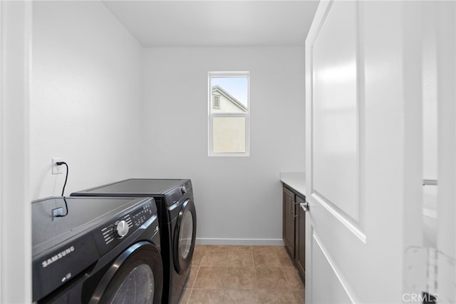 32182 Penstemon Way, Temecula, CA 92591 - laundry area with cabinet space, washer and clothes dryer, baseboards, and light tile patterned flooring