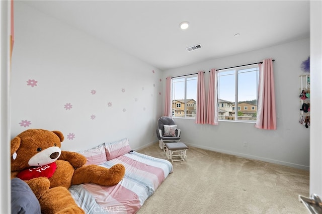 bedroom with carpet flooring and baseboards