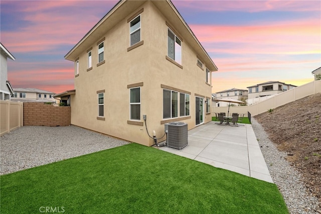 32182 Penstemon Way, Temecula, CA 92591 - back of house at dusk with central air condition unit, a patio, and stucco siding