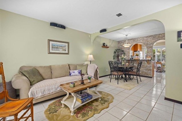 10158 Carefree Dr, Santee, CA 92071 - living area with arched walkways, light tile patterned floors, and baseboards