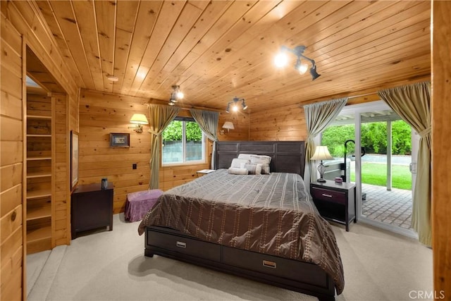 1005 E Woodland Ln, Glendora, CA 91741 - carpeted bedroom featuring access to outside, wood walls, and wooden ceiling
