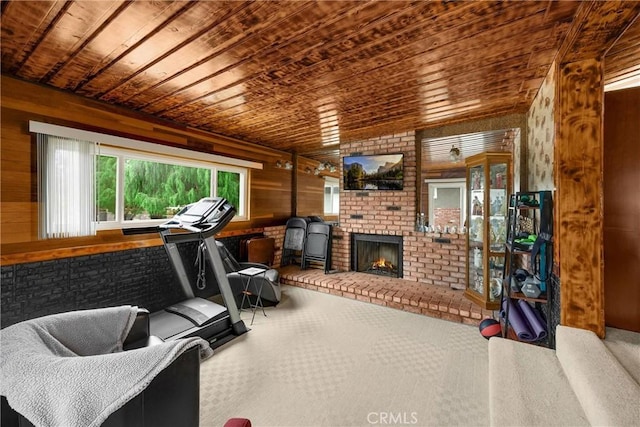 1005 E Woodland Ln, Glendora, CA 91741 - workout room with wood ceiling, plenty of natural light, wooden walls, carpet flooring, and a fireplace