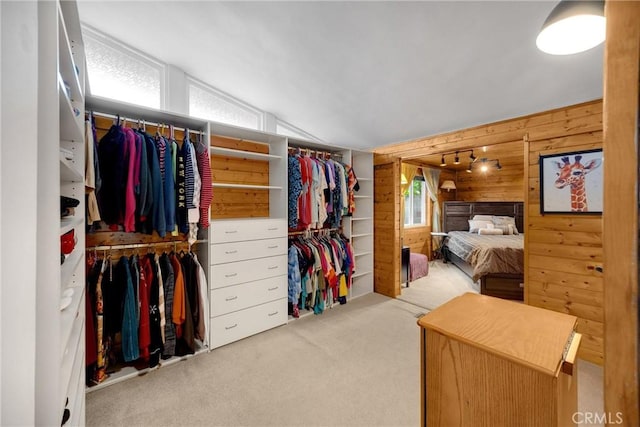 1005 E Woodland Ln, Glendora, CA 91741 - bedroom featuring wooden walls, carpet flooring, and vaulted ceiling