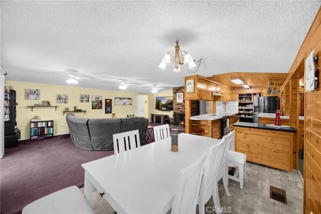 1005 E Woodland Ln, Glendora, CA 91741 - dining area with a textured ceiling, a chandelier, ceiling fan, and light carpet