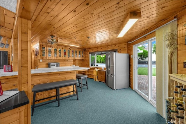 1005 E Woodland Ln, Glendora, CA 91741 - kitchen featuring freestanding refrigerator, carpet floors, a peninsula, glass insert cabinets, and wood ceiling
