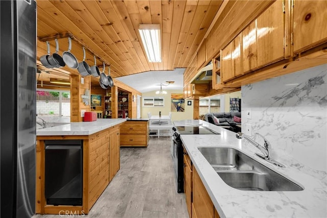 1005 E Woodland Ln, Glendora, CA 91741 - kitchen featuring a sink, freestanding refrigerator, electric range oven, brown cabinetry, and light wood finished floors