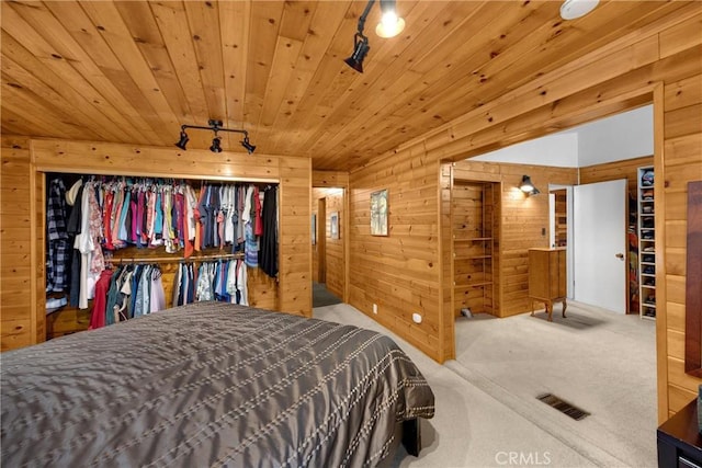 1005 E Woodland Ln, Glendora, CA 91741 - bedroom featuring wooden walls, track lighting, carpet, and wood ceiling