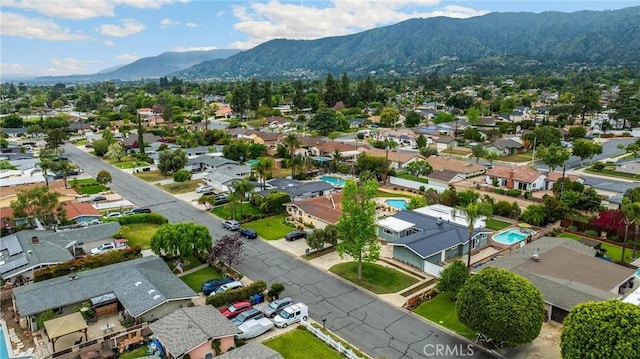 1005 E Woodland Ln, Glendora, CA 91741 - aerial perspective of suburban area with mountains and a pool area