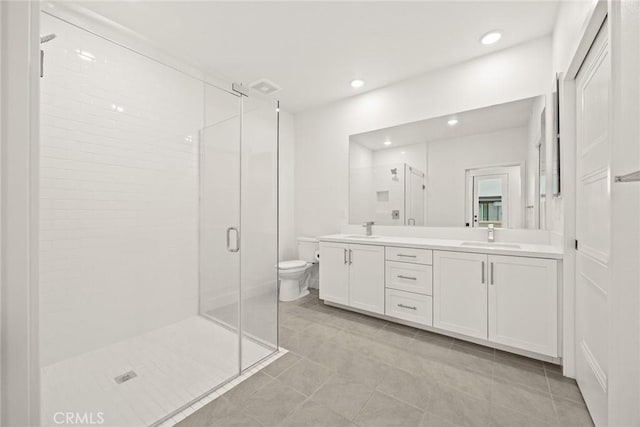 16321 Dawn Way Unit 108, Tustin, CA 92782 - full bath featuring a shower stall, double vanity, toilet, tile patterned floors, and recessed lighting