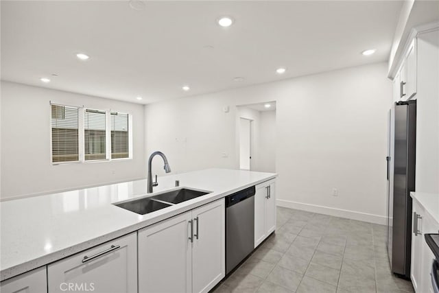 16321 Dawn Way Unit 108, Tustin, CA 92782 - kitchen featuring appliances with stainless steel finishes, a sink, white cabinetry, recessed lighting, and baseboards