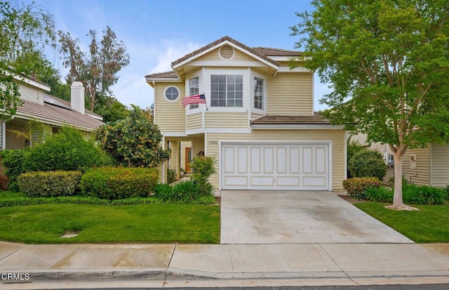 11998 Bubbling Brook St, Moorpark, CA 93021 - traditional home featuring an attached garage, driveway, a front lawn, and a tile roof
