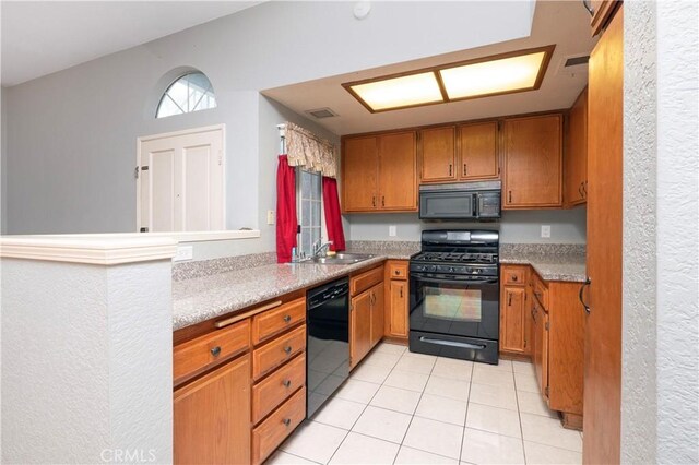 776 E San Bernardino Rd Unit 3, Covina, CA 91723 - kitchen featuring black appliances, a sink, brown cabinets, light tile patterned flooring, and a textured wall