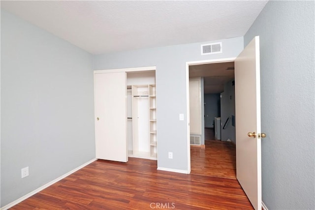 776 E San Bernardino Rd Unit 3, Covina, CA 91723 - unfurnished bedroom with wood finished floors, baseboards, and a closet