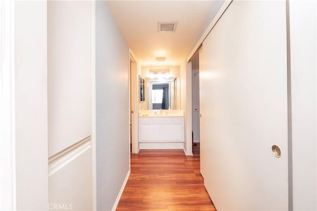 776 E San Bernardino Rd Unit 3, Covina, CA 91723 - hallway with wood finished floors, baseboards, and a sink