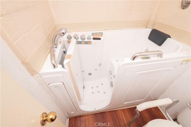 776 E San Bernardino Rd Unit 3, Covina, CA 91723 - full bath with wood finished floors, a jetted tub, and toilet