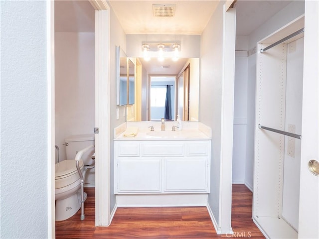 776 E San Bernardino Rd Unit 3, Covina, CA 91723 - bathroom featuring toilet, wood finished floors, and vanity