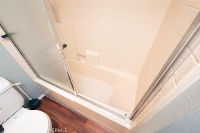 776 E San Bernardino Rd Unit 3, Covina, CA 91723 - bathroom featuring toilet, wood finished floors, and shower / bath combination with glass door