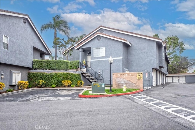776 E San Bernardino Rd Unit 3, Covina, CA 91723 - view of front of house featuring stucco siding and stairway
