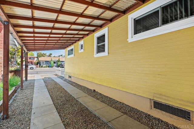 view of side of property featuring crawl space