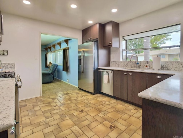 9884 Settle Rd, Santee, CA 92071 - kitchen featuring stainless steel appliances, a sink, dark brown cabinetry, recessed lighting, and baseboards