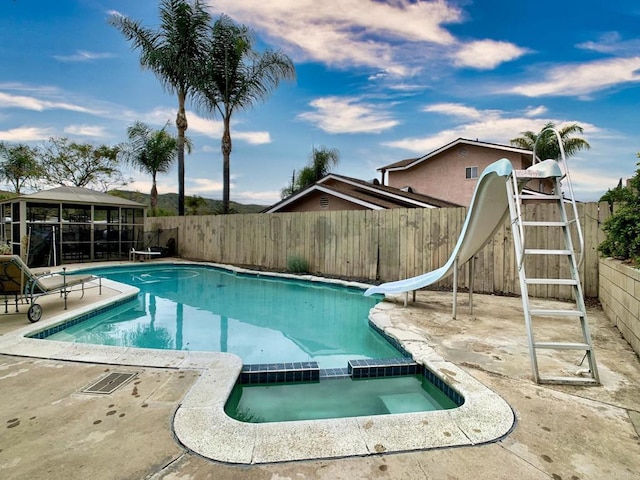 9884 Settle Rd, Santee, CA 92071 - view of swimming pool featuring a water slide, a fenced backyard, a diving board, and a patio area