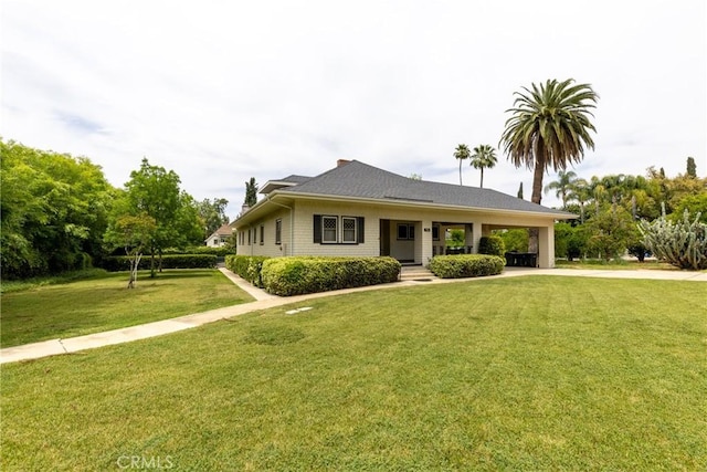 view of front facade featuring concrete driveway and a front lawn