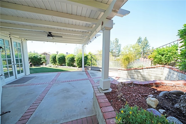 view of patio / terrace with french doors, a ceiling fan, and a fenced backyard